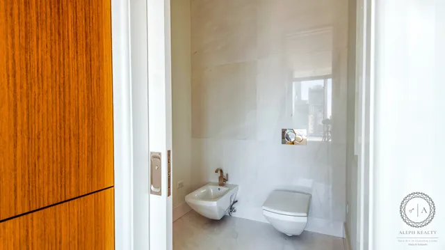 a bedroom with a bed and a night stand