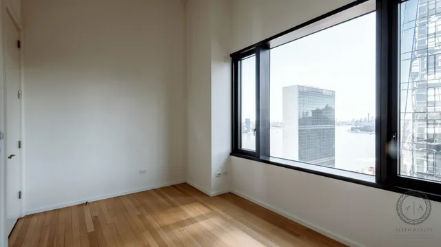 a en suite bathroom with a tub mirror and sink