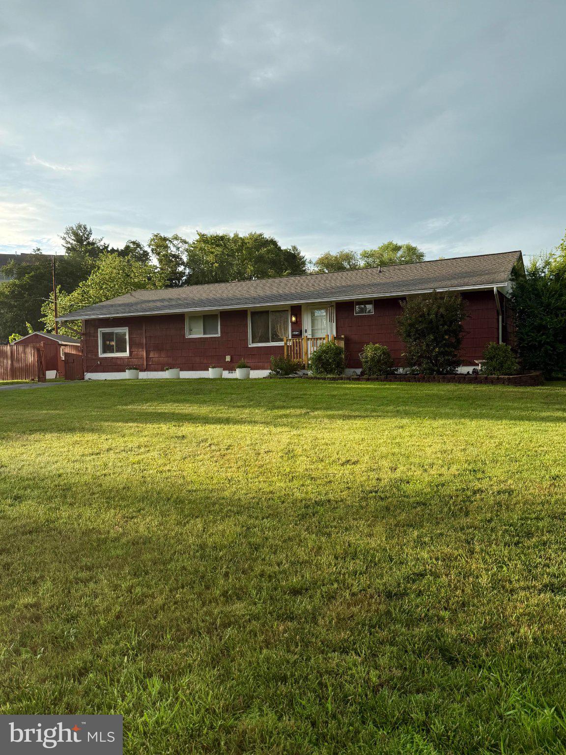 906 Wingfield Road Woodbridge, VA 22191 - Photo 1 of 1 Charming red home on lush green lawn.