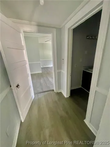 hallway view with floor to ceiling window and entryway