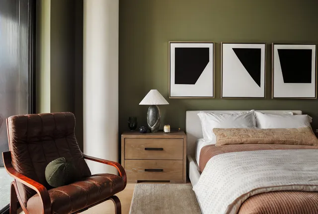 a bedroom with a bed and dresser