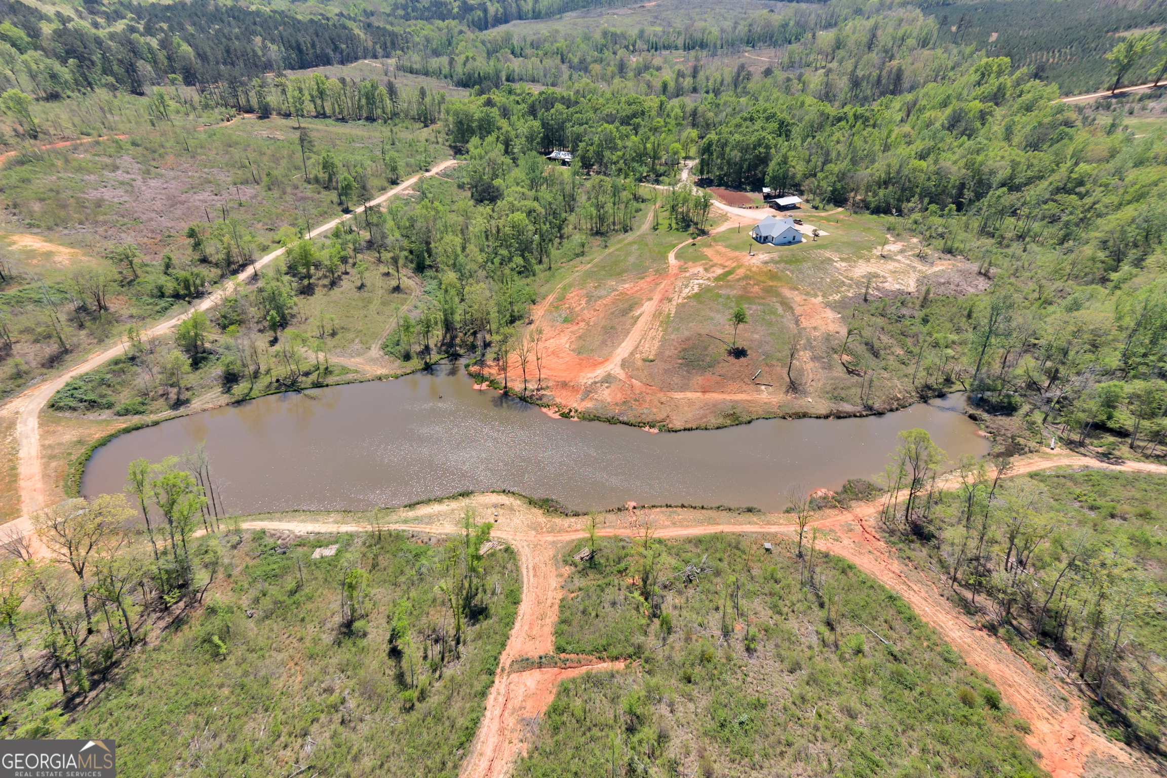 4348 Marshall Stewart Road Southwest Crawfordville, GA 30631 - Photo 116 of 120 an aerial view of a house with a yard and lake