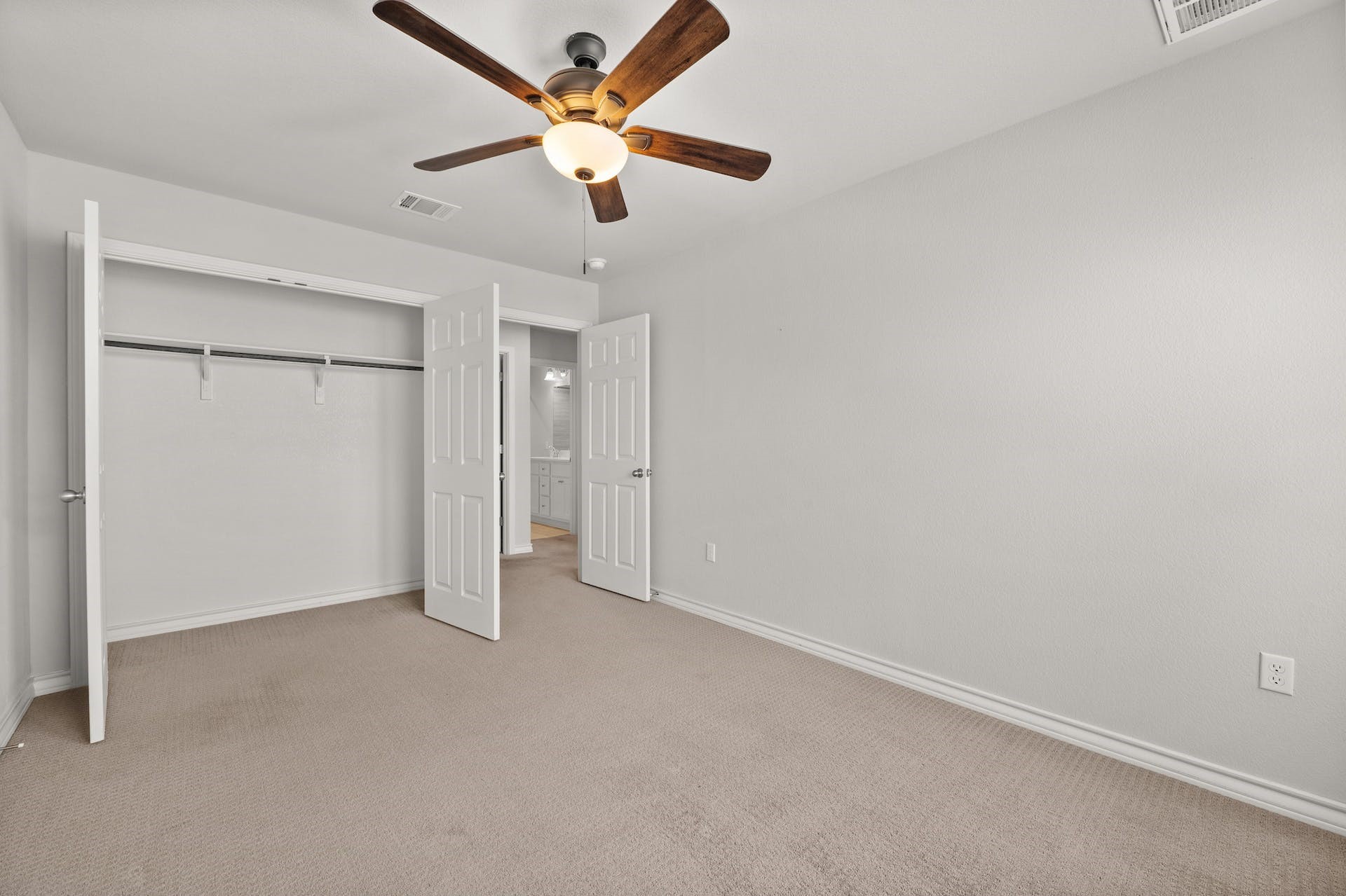 5107 Lemon Tree Path, Unit 127 Austin, TX 78723 - Photo 30 of 40 an empty room with a ceiling fan and a window