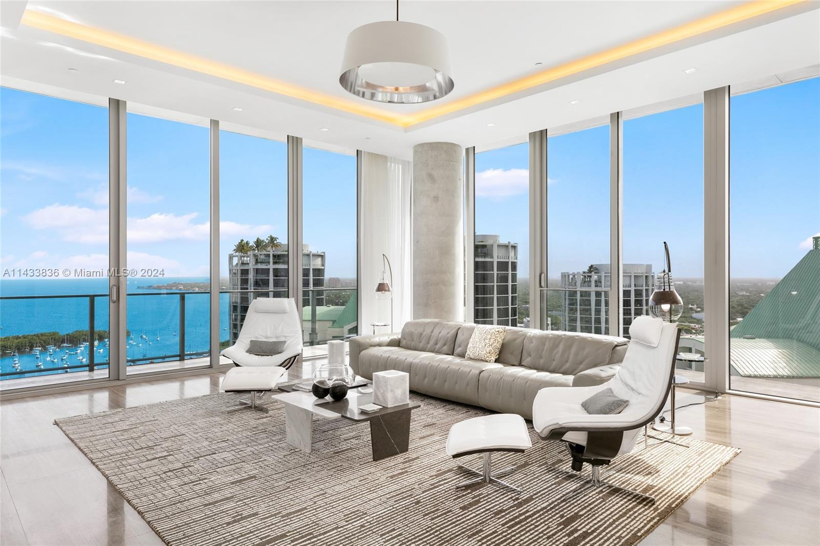 2669 South Bayshore Drive, Unit LPHN Miami, FL 33133 - Photo 1 of 66 a living room with furniture and a large window