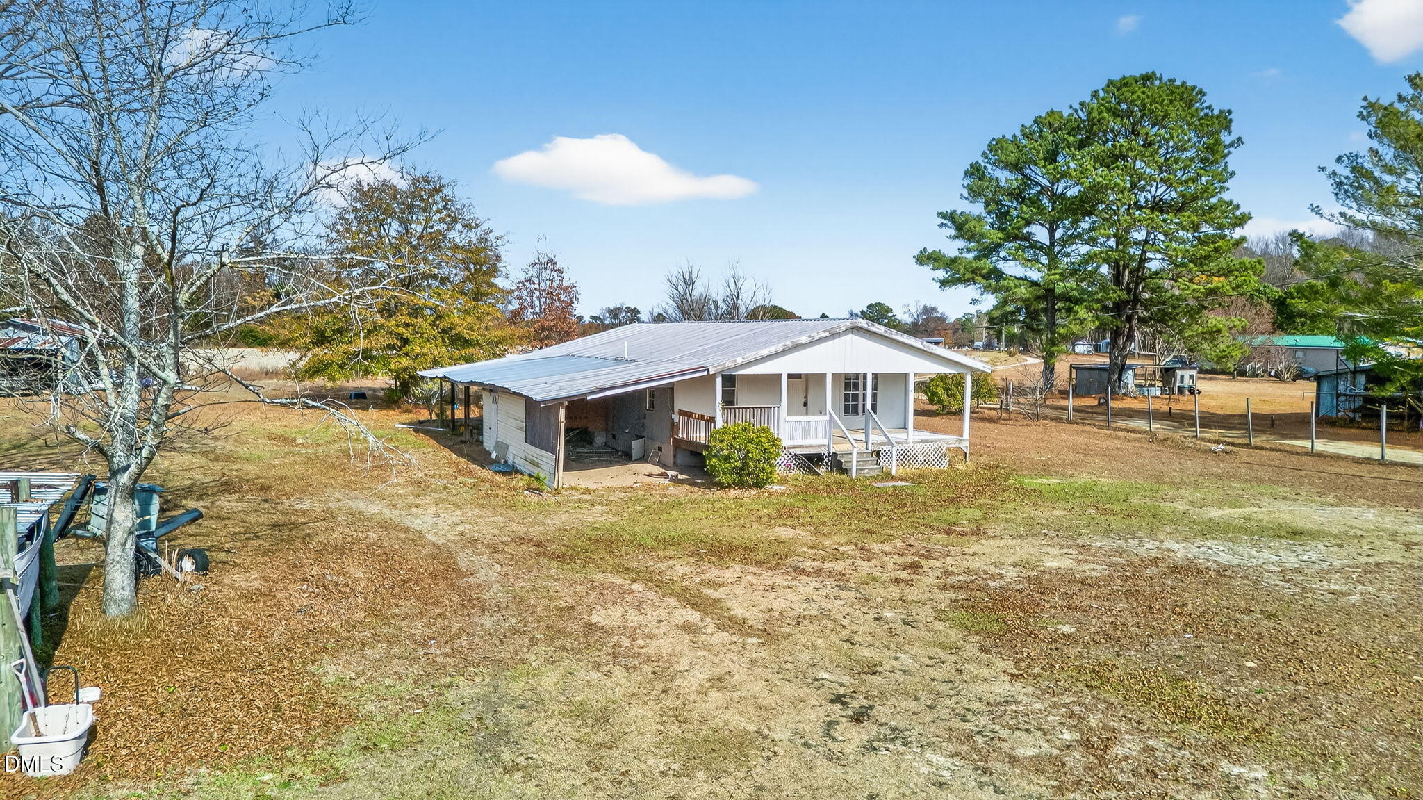 256 Stricklands Crossroads Road Four Oaks, NC 27524 - Photo 16 of 16 a view of a house with a yard