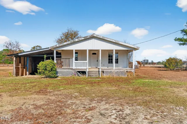 a view of a house with pool yard and front view of a house