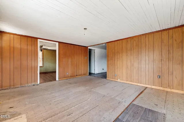 an empty room with closet area