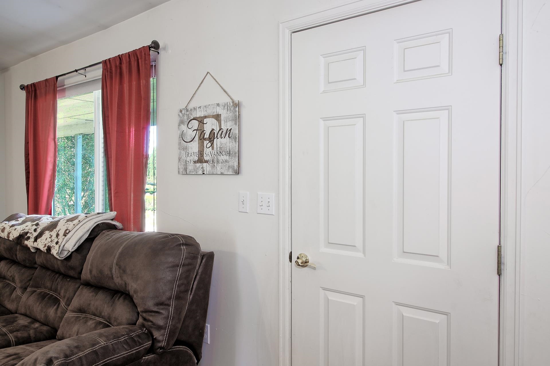 1742 10 Road Mack, CO 81525 - Photo 24 of 42 a living room with furniture and a window