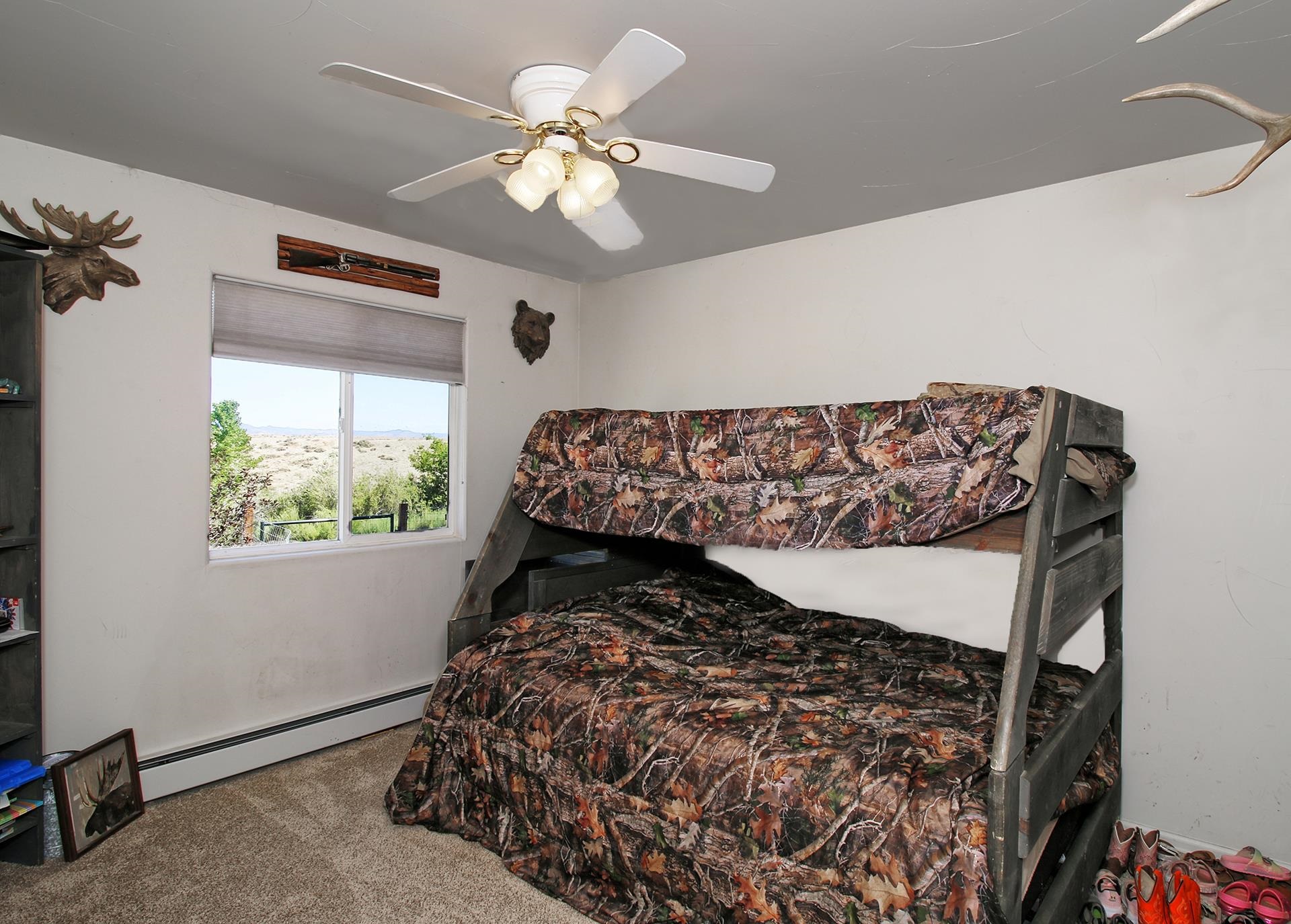 1742 10 Road Mack, CO 81525 - Photo 41 of 42 a bed sitting in a bedroom next to a window