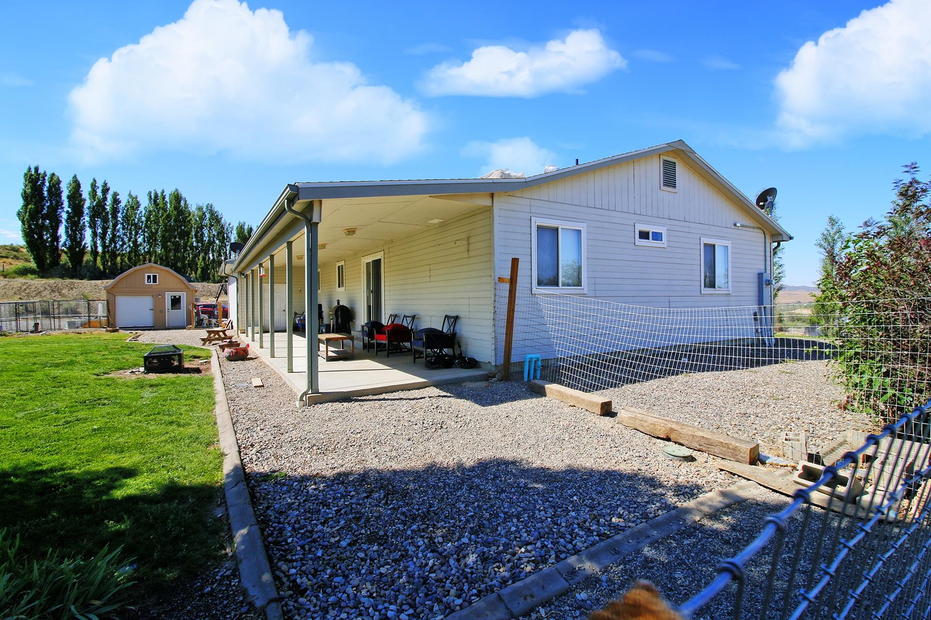 1742 10 Road Mack, CO 81525 - Photo 7 of 42 a front view of a house with garden