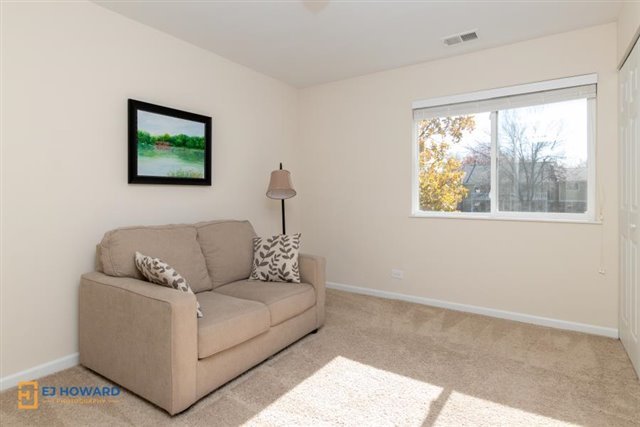 131 Century Court, Unit O2 Schaumburg, IL 60193 - Photo 11 of 16 a living room with furniture and a window