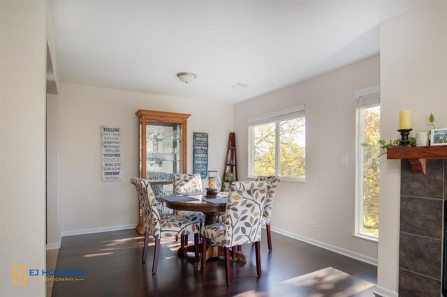 131 Century Court, Unit O2 Schaumburg, IL 60193 - Photo 5 of 16 a view of a dining room with furniture and wooden floor