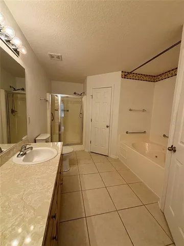 a bathroom with a sink double vanity and a mirror