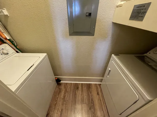 a view of a room with wooden floor and staircase