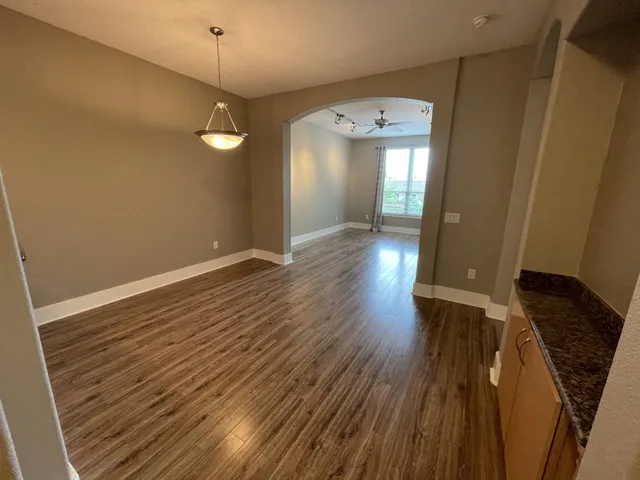 a view of a livingroom from a hallway