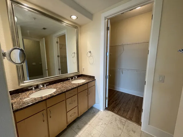 a bath tub sitting next to a shower