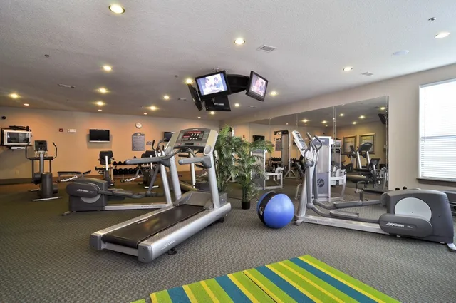 a living room with fireplace furniture and a large window