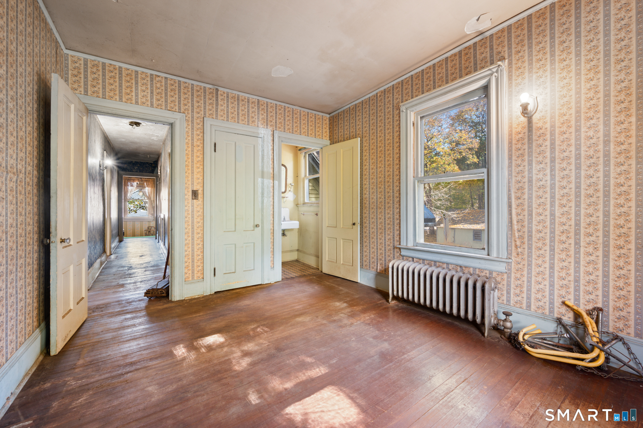 124 River Road Willington, CT 06279 - Photo 39 of 40 wooden floor in a hall with a window