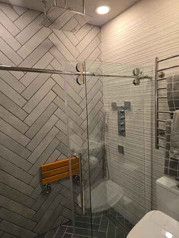 a bathroom with a toilet and a shower