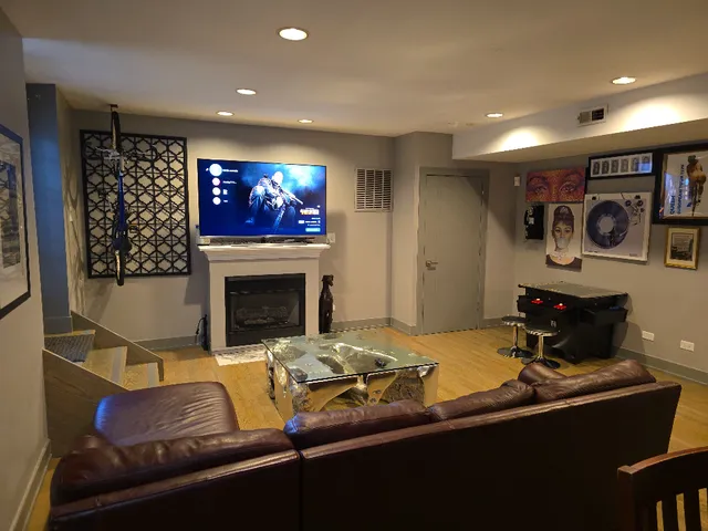 a living room with furniture and a fireplace
