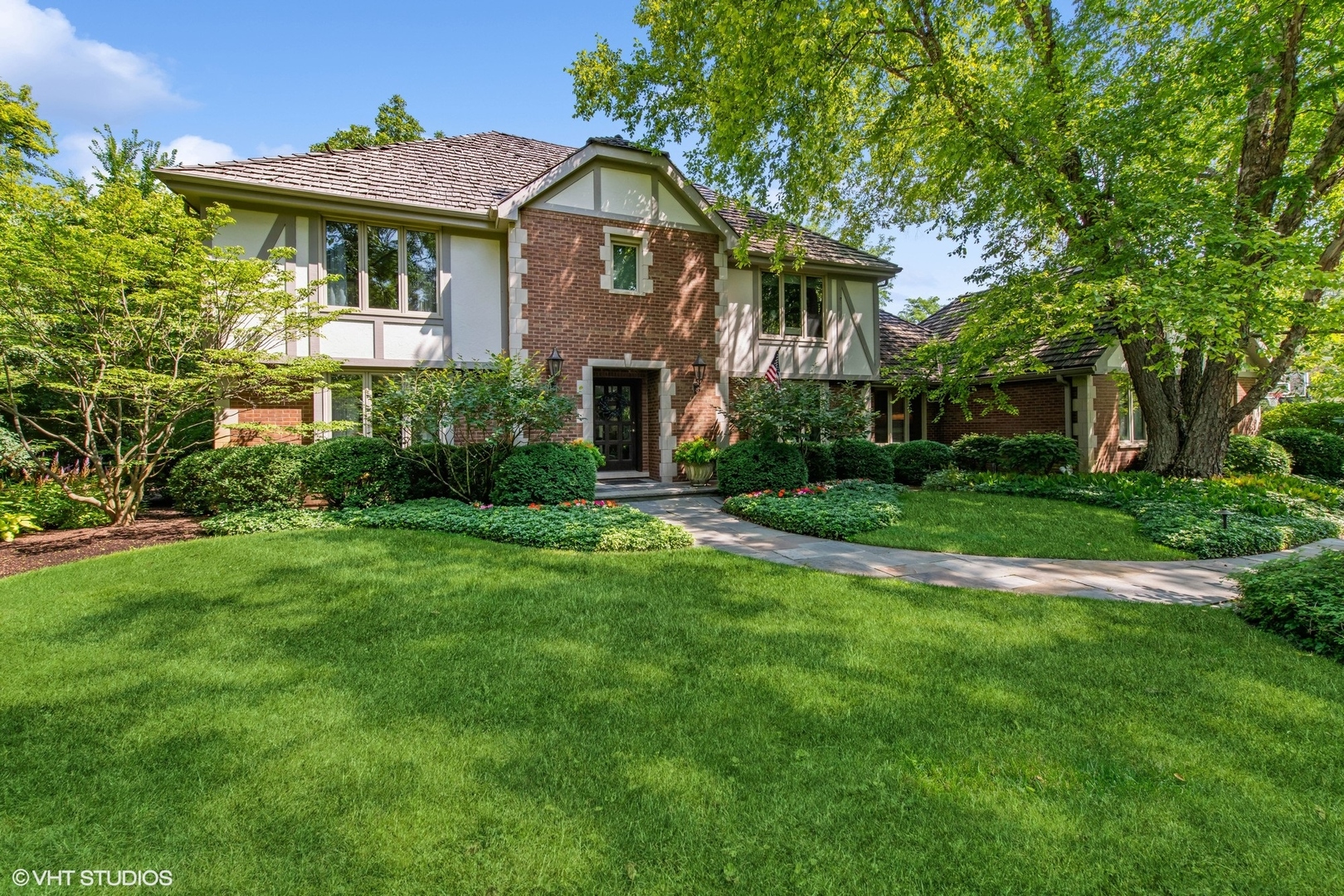 206 East Hillside Road Barrington, IL 60010 - Photo 1 of 42 a front view of a house with a yard