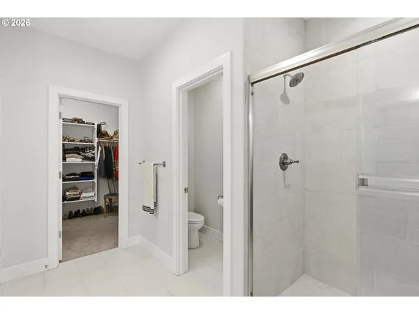 a bathroom with a shower and a sink