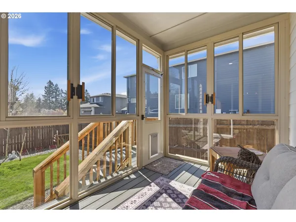 a view of a balcony with wooden floor