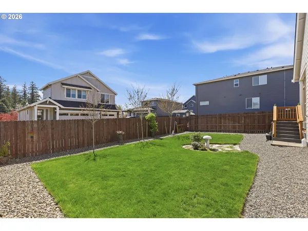 a backyard of a house with lots of green space