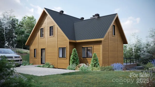 a view of backyard of house with green space