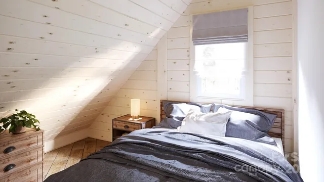 a view of a bedroom with bed and a window