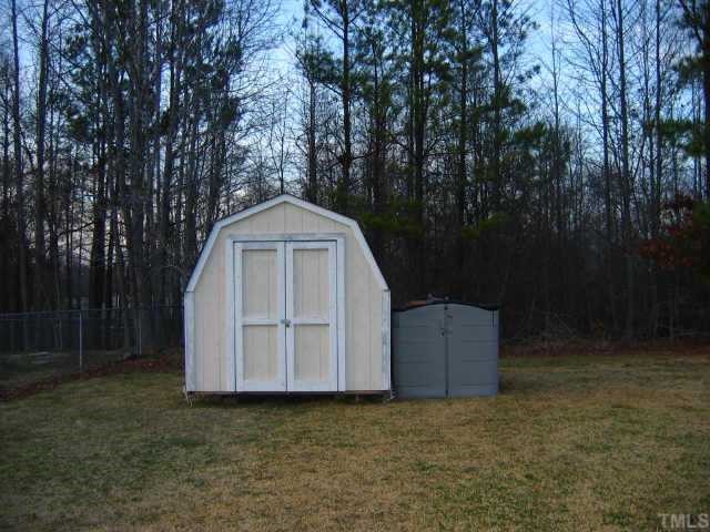 8099 Covered Bridge Road Wendell, NC 27591 - Photo 10 of 12 Storage barn in rear of 1 acre lot