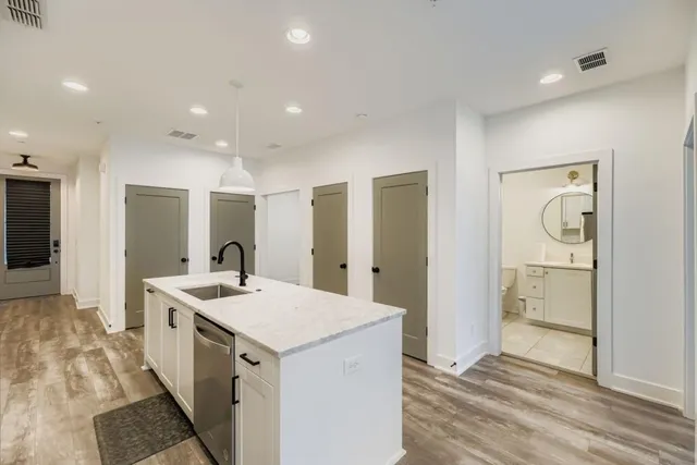 a kitchen with a sink and refrigerator