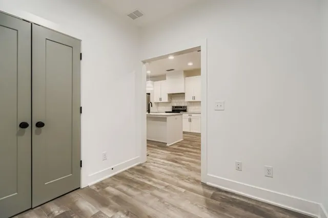 a view of a kitchen from the hallway
