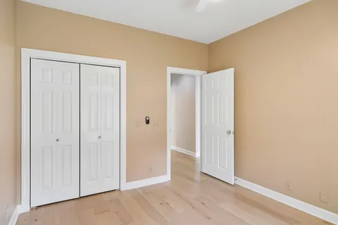 a view of an empty room with a fireplace