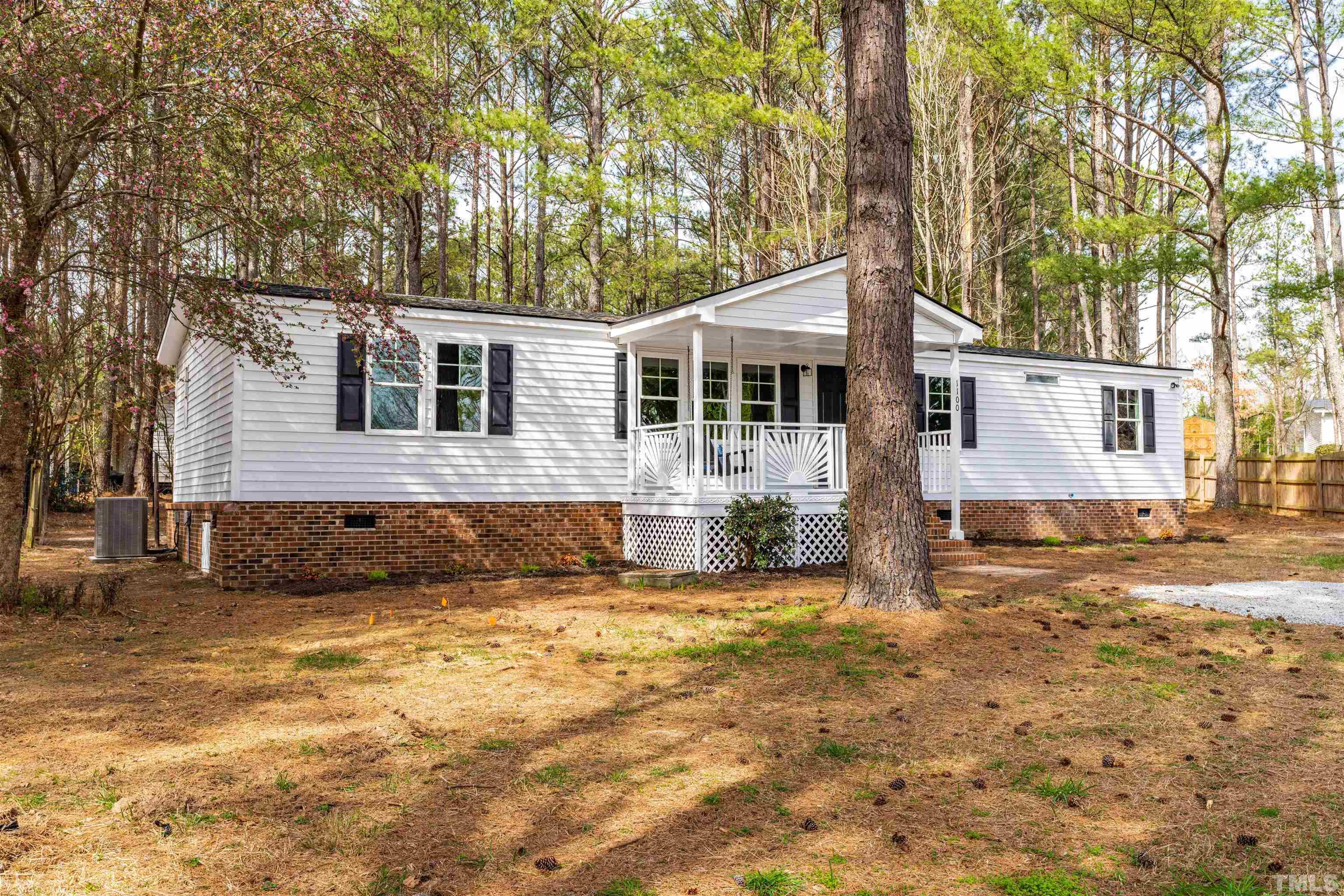 1100 Yakimas Road Raleigh, NC 27603 - Photo 2 of 26 a front view of a house with a yard