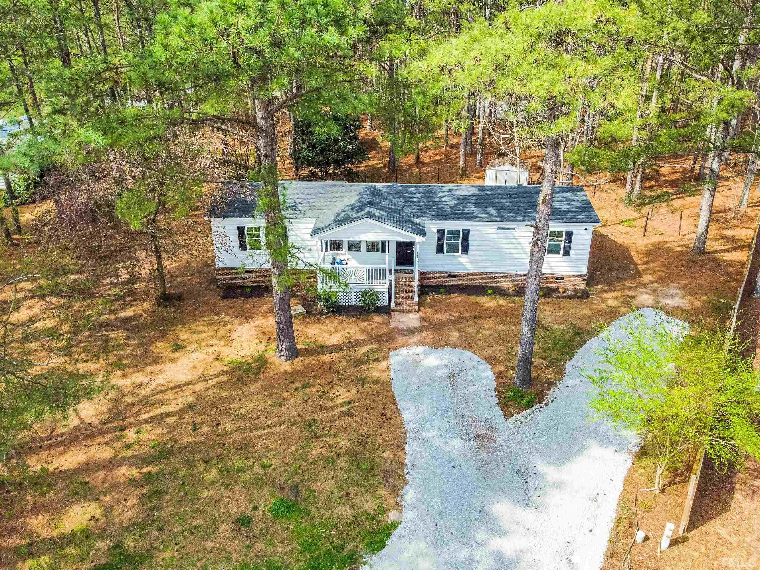 1100 Yakimas Road Raleigh, NC 27603 - Photo 4 of 26 a front view of a house with a yard