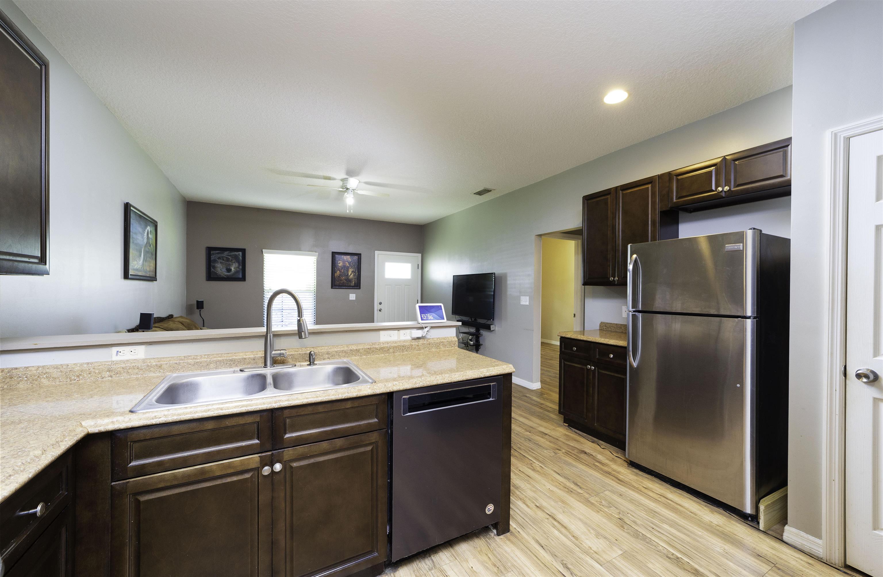 122 Osprey Road St. Augustine, FL 32086 - Photo 14 of 50 a kitchen with kitchen island a counter top space cabinets and stainless steel appliances