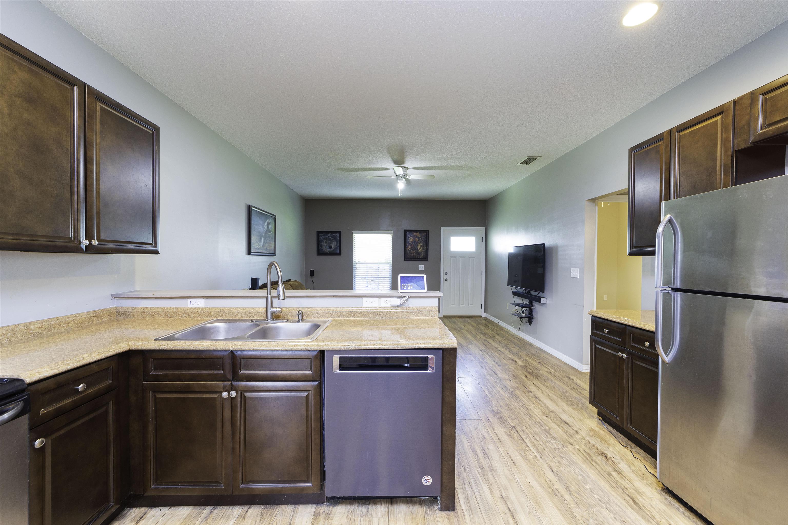 122 Osprey Road St. Augustine, FL 32086 - Photo 15 of 50 a kitchen with stainless steel appliances granite countertop a sink stove and refrigerator