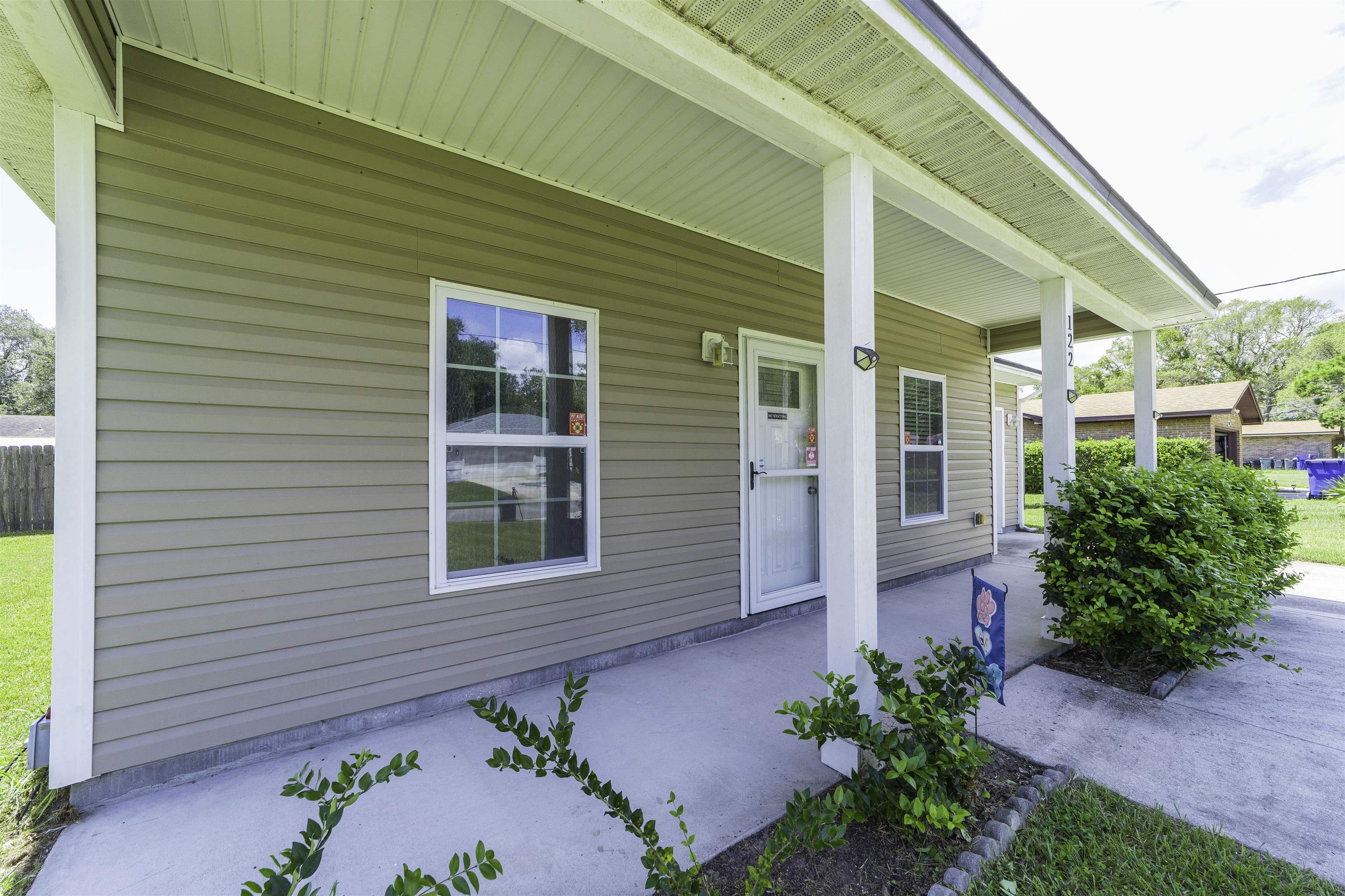 122 Osprey Road St. Augustine, FL 32086 - Photo 2 of 50 a front view of a house with a yard