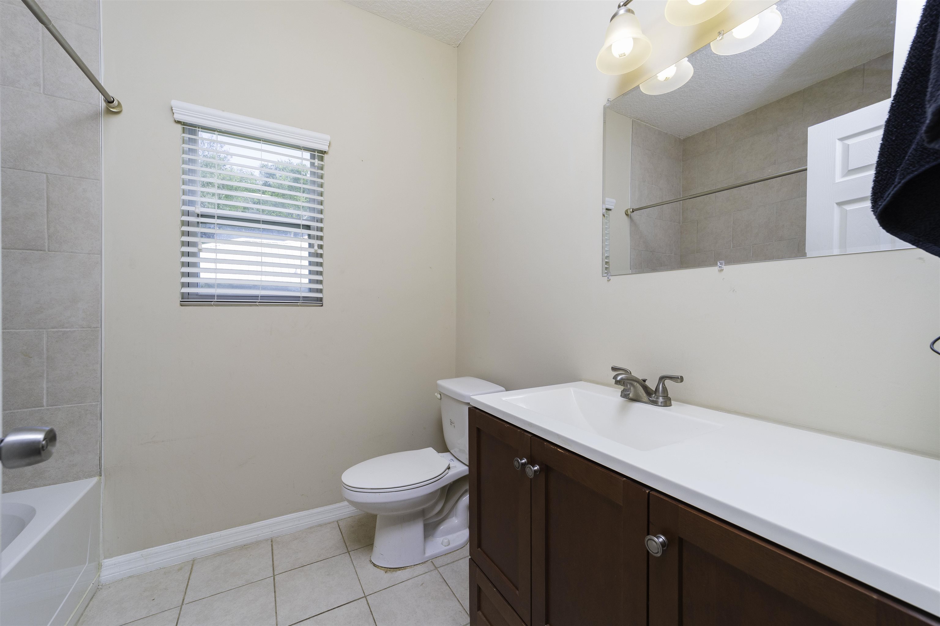 122 Osprey Road St. Augustine, FL 32086 - Photo 22 of 50 a bathroom with a sink a toilet and mirror