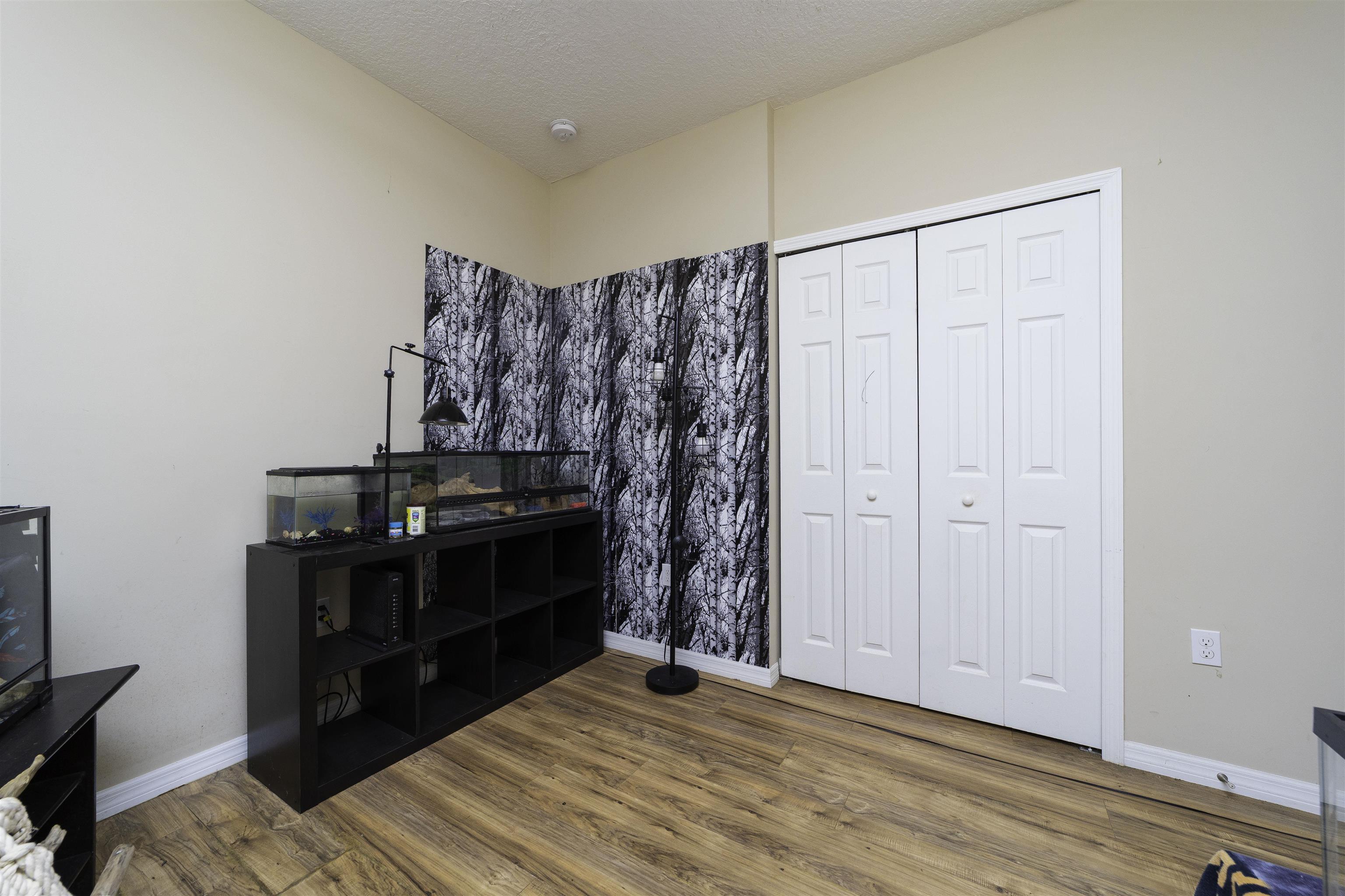 122 Osprey Road St. Augustine, FL 32086 - Photo 29 of 50 a view of a room with furniture and wooden floor