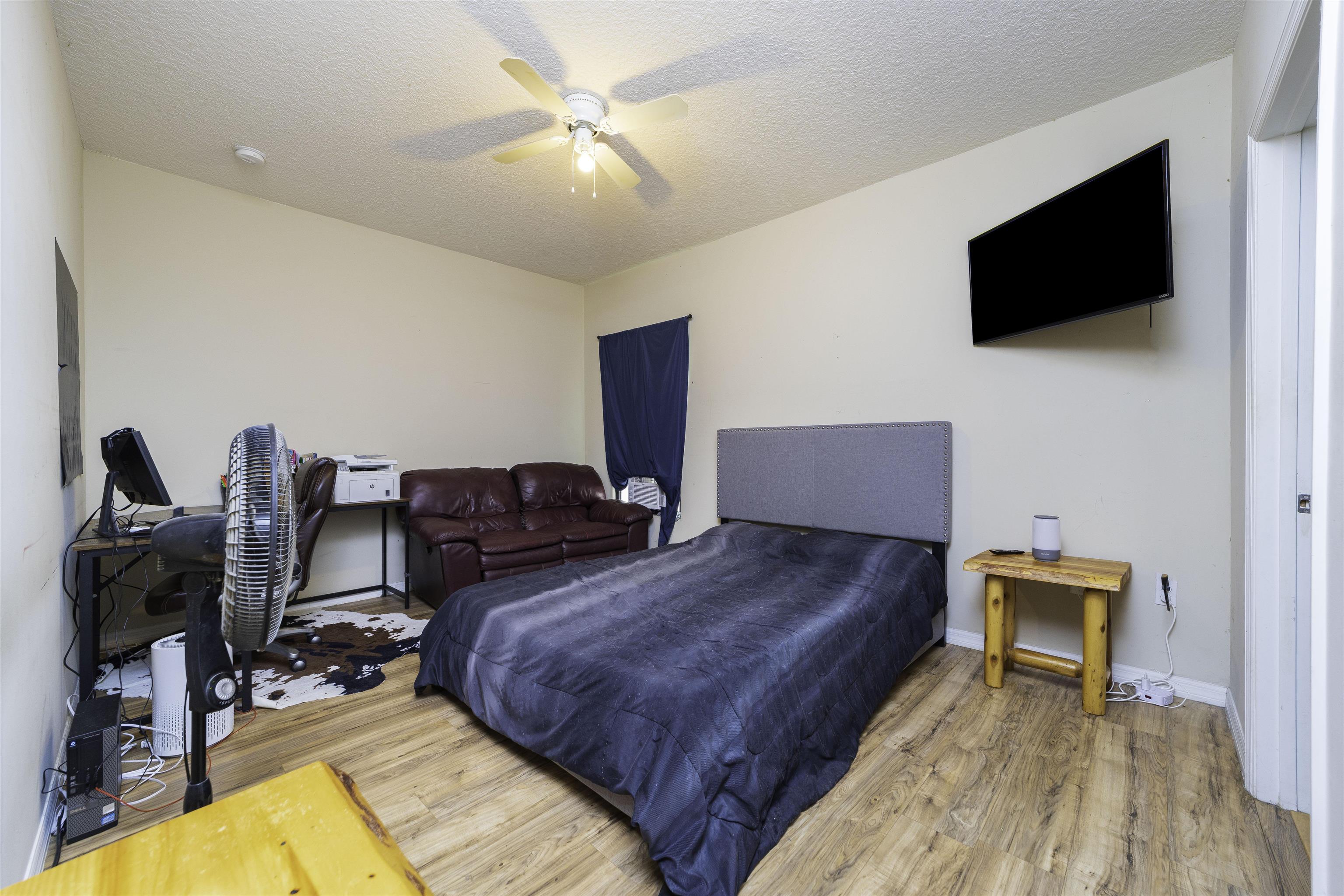 122 Osprey Road St. Augustine, FL 32086 - Photo 30 of 50 a living room with furniture and a flat screen tv