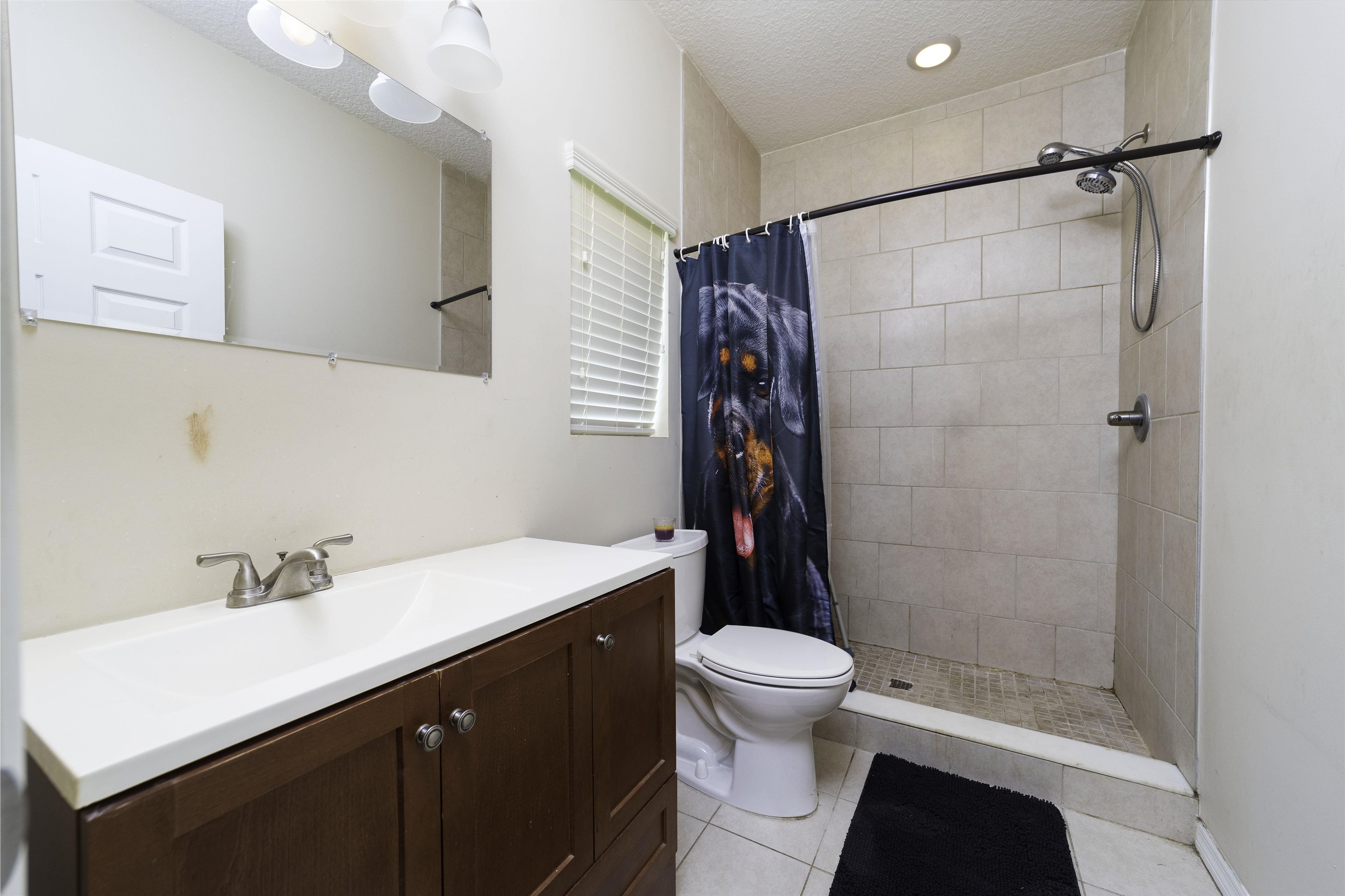 122 Osprey Road St. Augustine, FL 32086 - Photo 34 of 50 a bathroom with a sink a toilet and shower