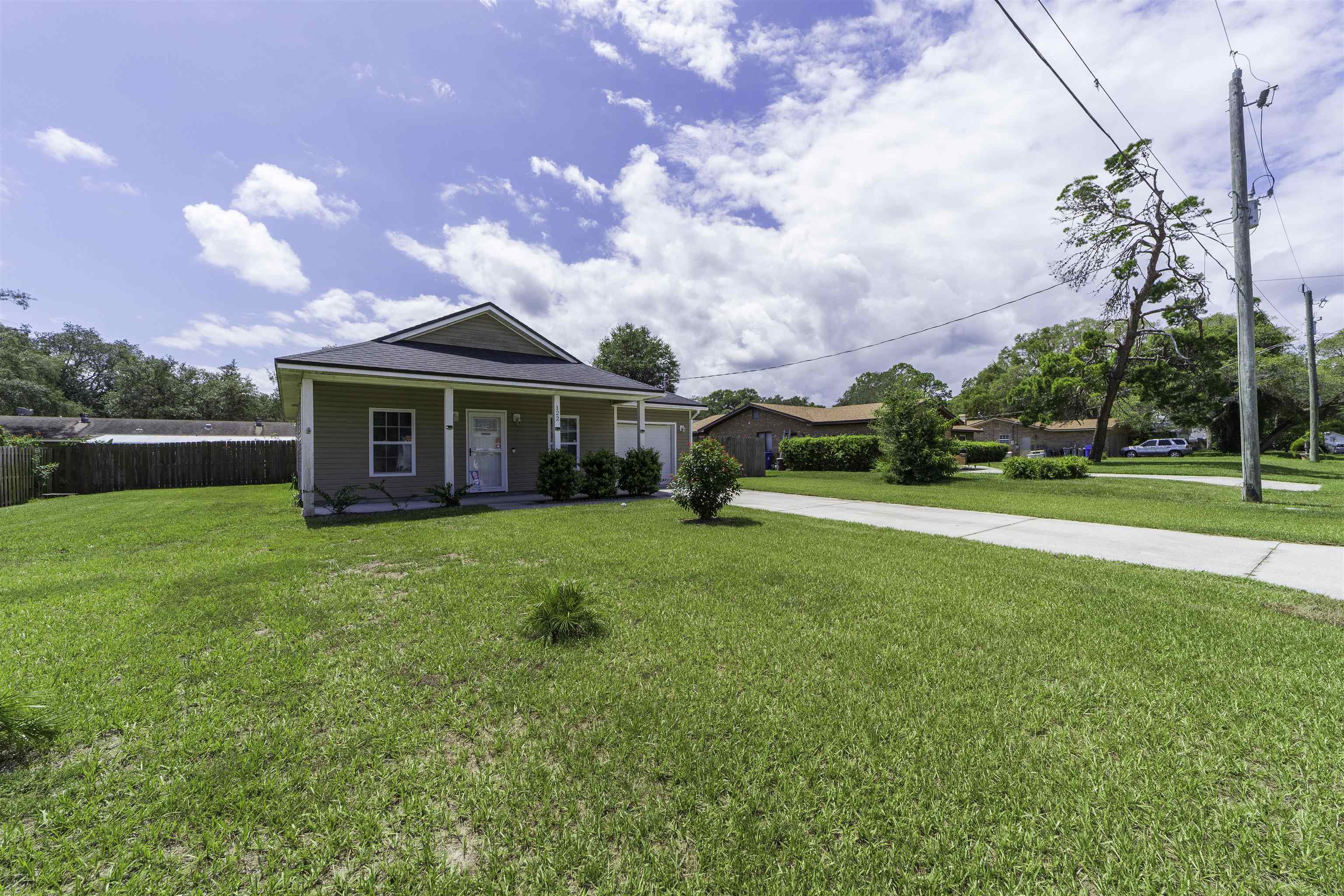 122 Osprey Road St. Augustine, FL 32086 - Photo 4 of 50 a view of a house with a big yard and a large tree