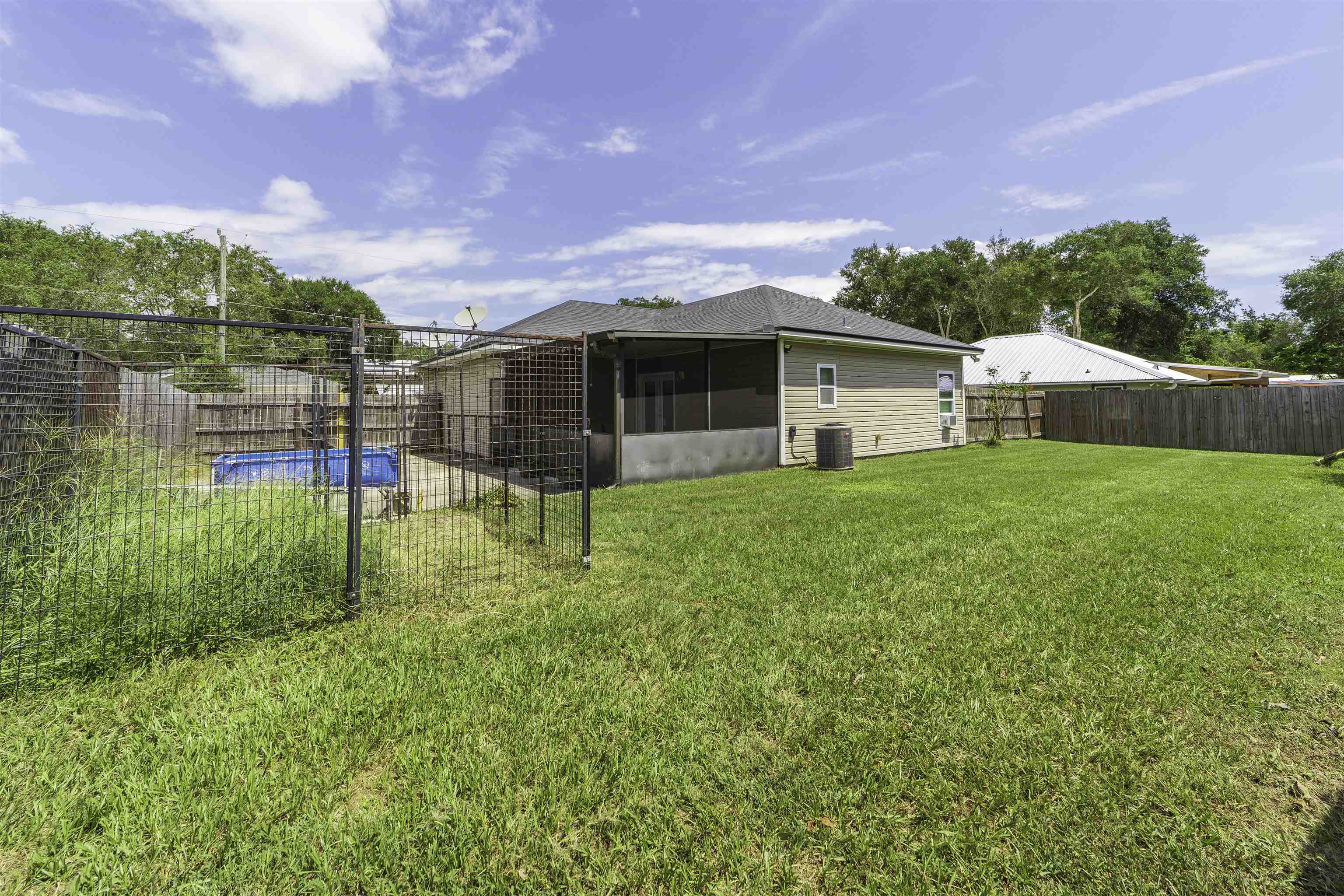 122 Osprey Road St. Augustine, FL 32086 - Photo 42 of 50 a view of a house with a yard and sitting area