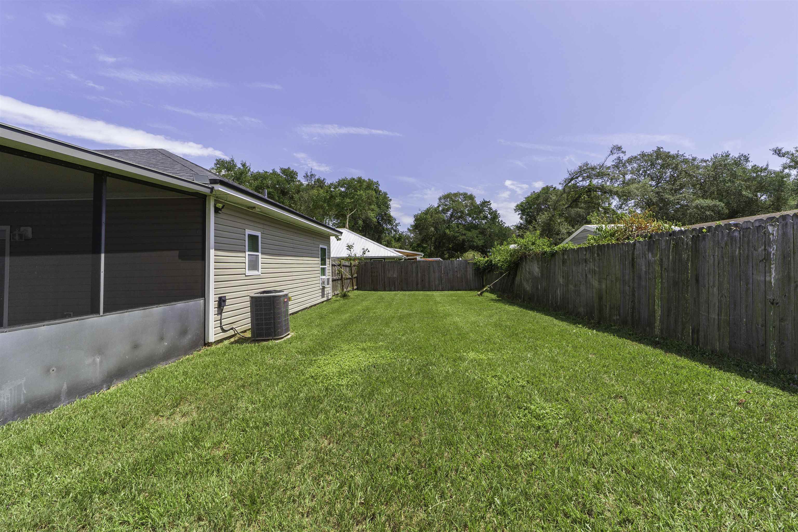 122 Osprey Road St. Augustine, FL 32086 - Photo 43 of 50 a view of a backyard with a garden