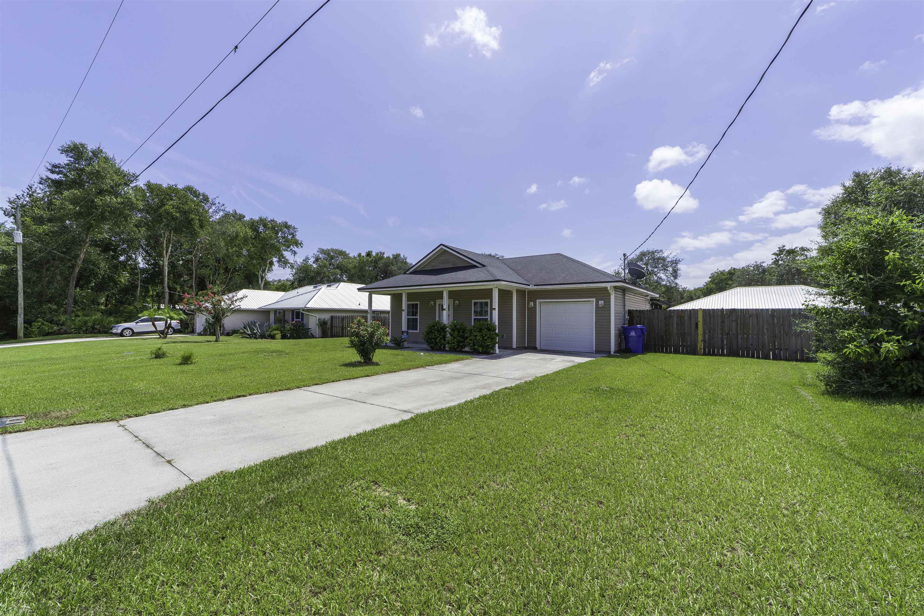 122 Osprey Road St. Augustine, FL 32086 - Photo 48 of 50 a front view of a house with a yard
