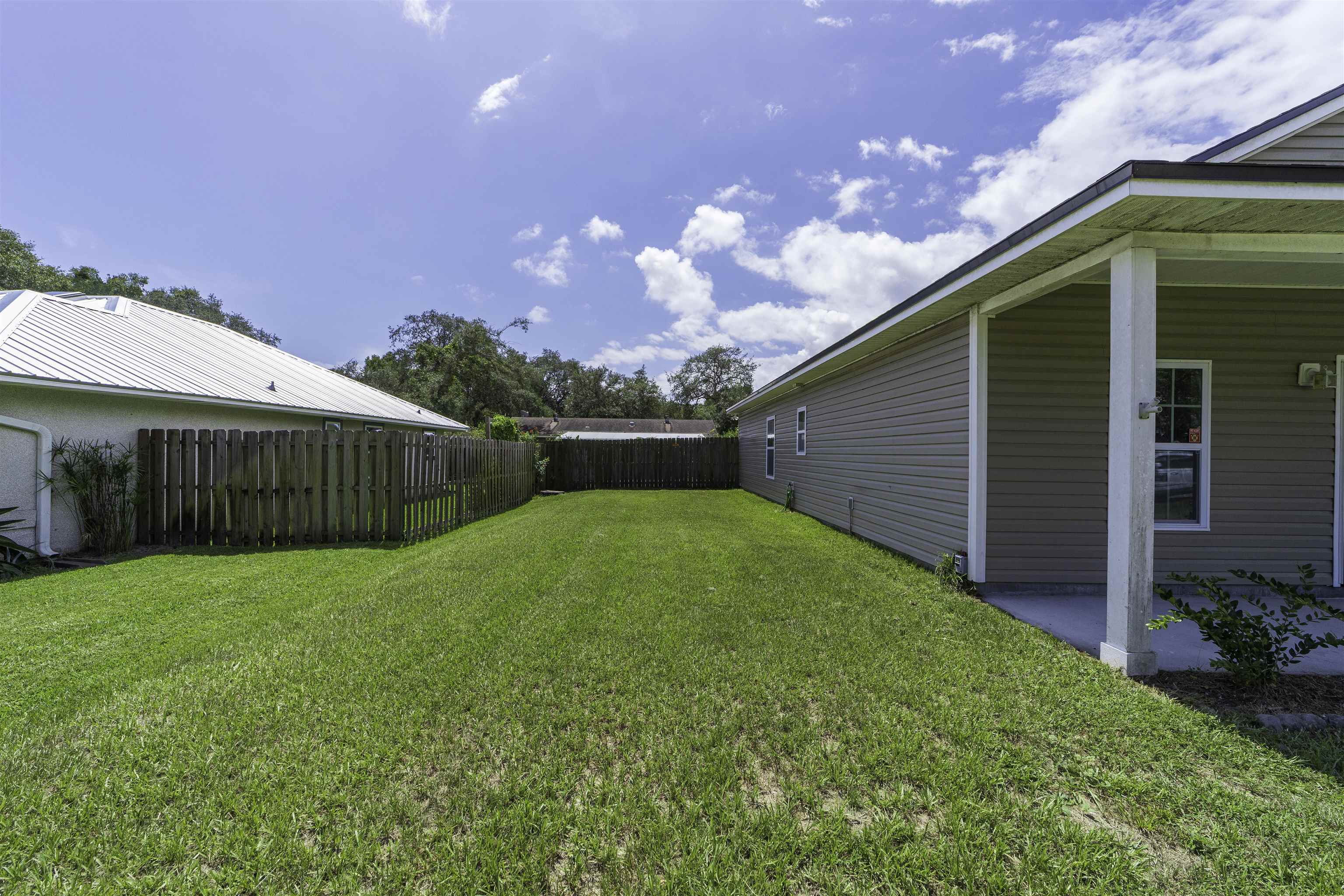 122 Osprey Road St. Augustine, FL 32086 - Photo 50 of 50 a view of a backyard with a garden