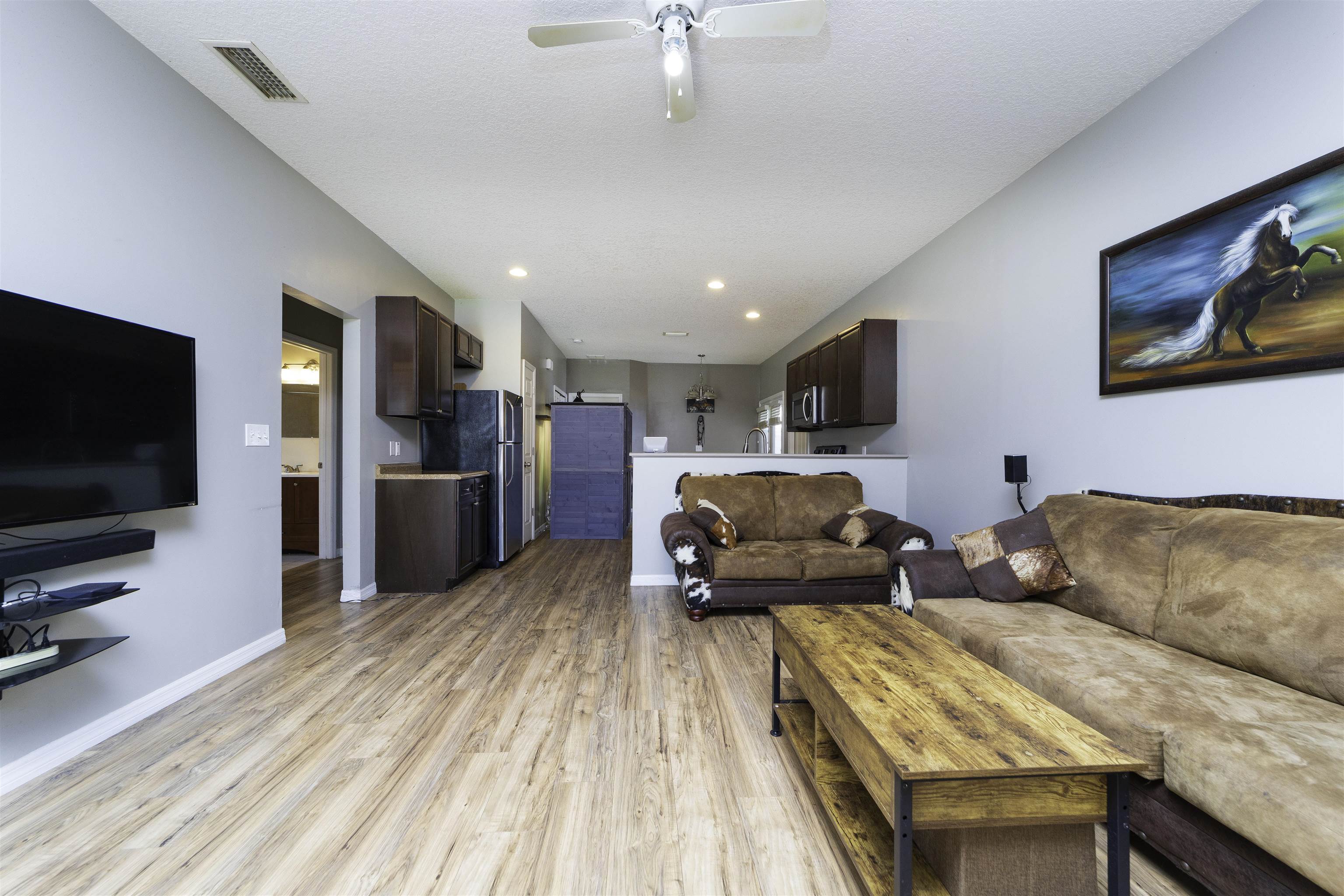 122 Osprey Road St. Augustine, FL 32086 - Photo 6 of 50 a living room with furniture and a flat screen tv