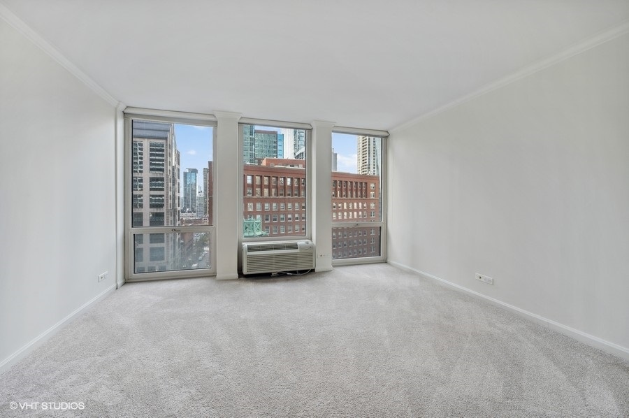 111 East Chestnut Street, Unit 14K Chicago, IL 60611 - Photo 17 of 20 a view of an empty room with a window